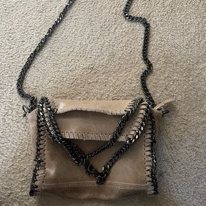 Taupe leather purse with long strap & two shoulder straps that fold the flaps